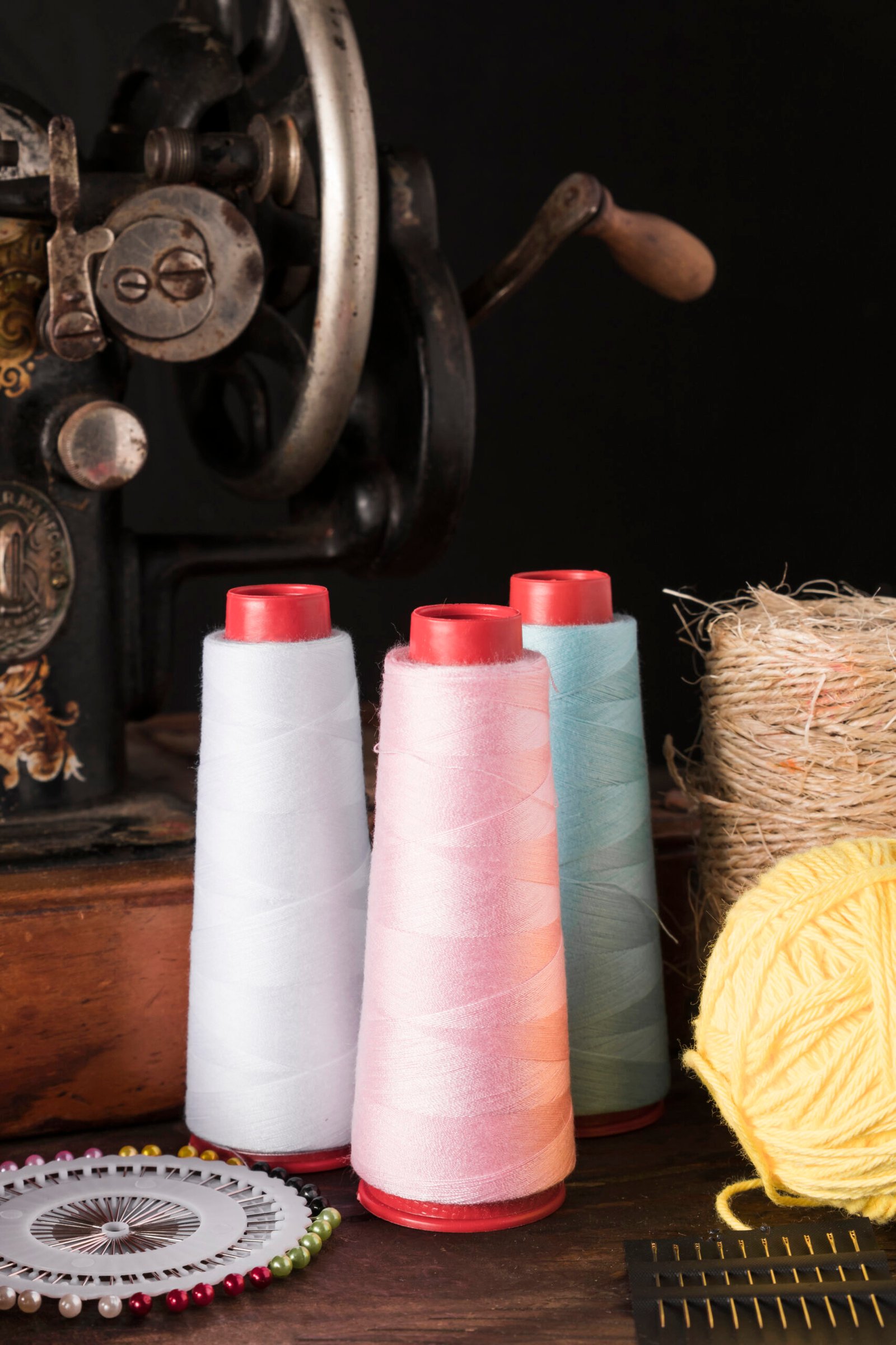 threads-needles-near-sewing-machine